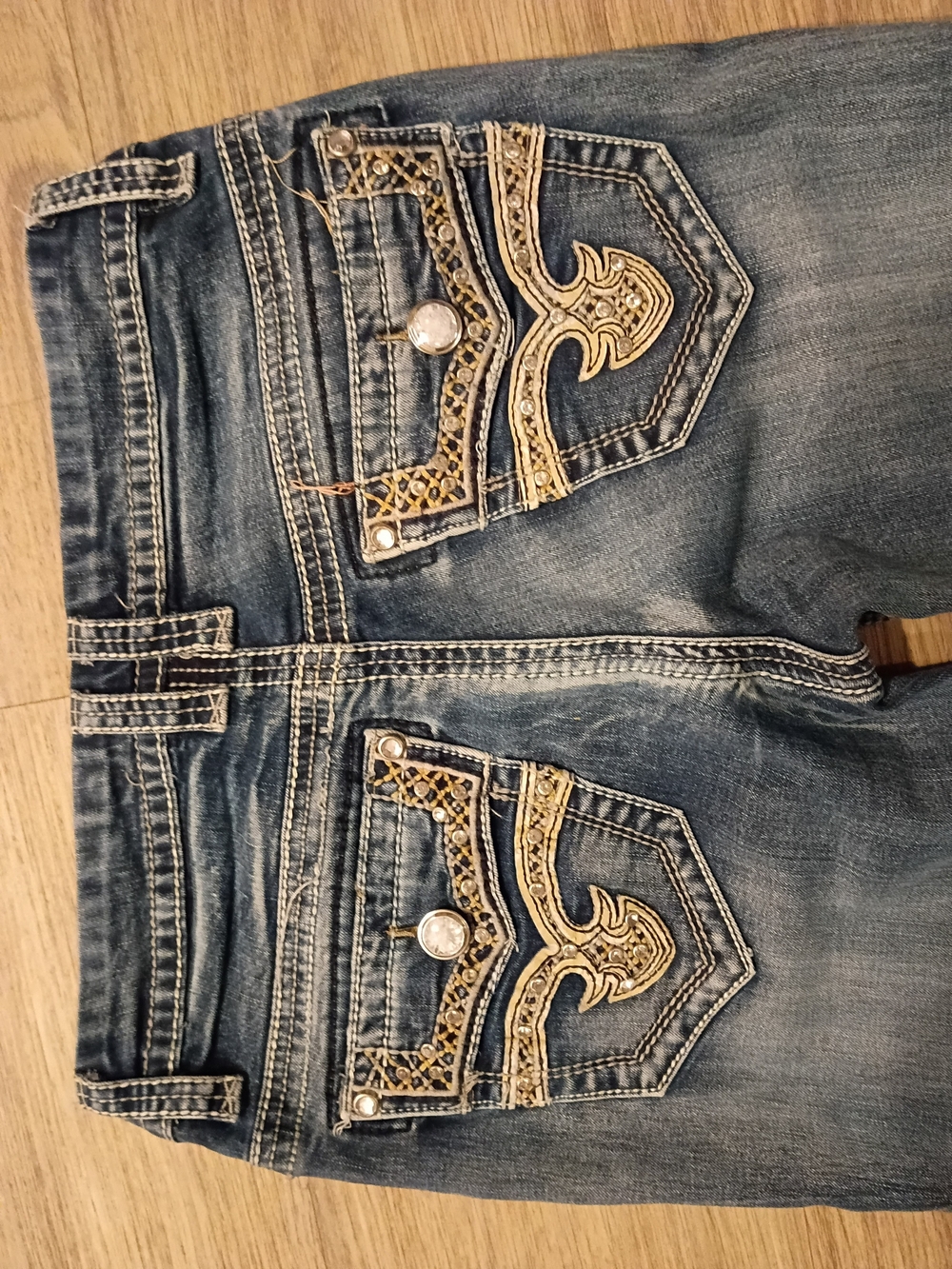 Rebel's Embellished Blue Jeans with Gold Accent Back Pockets.